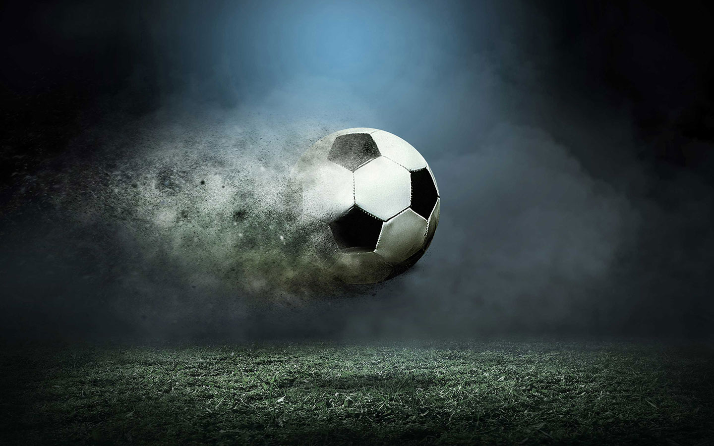 Soccer ball in motion over grassy area